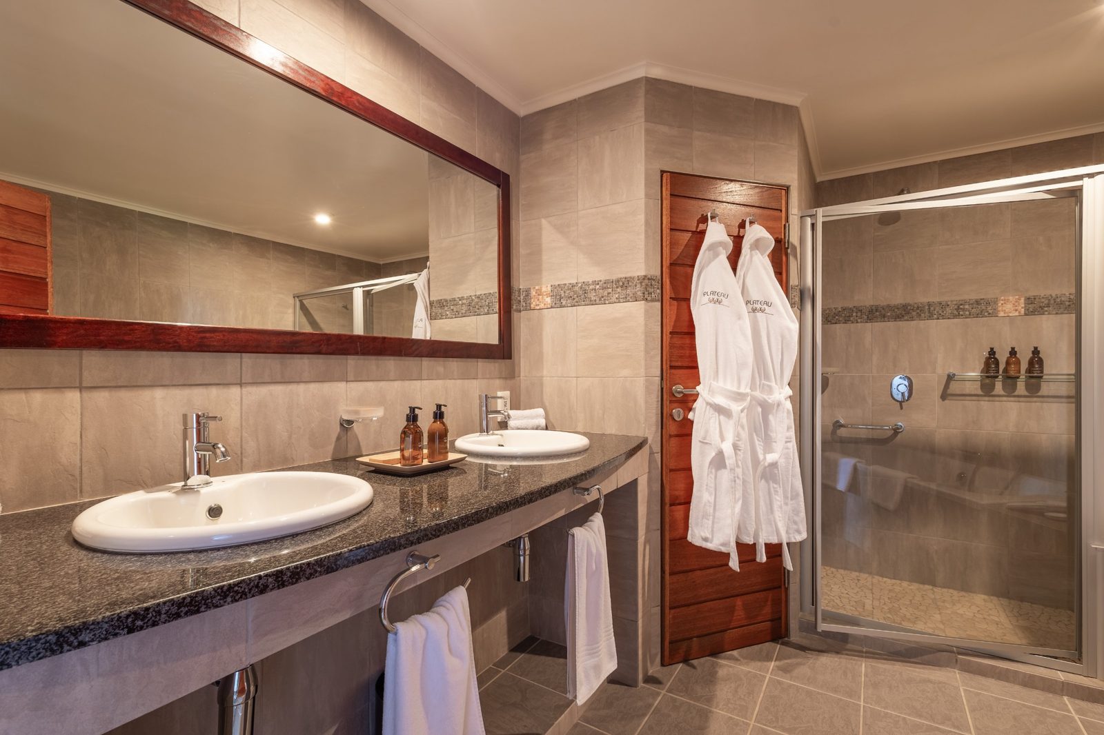 Lodge bathroom with twin basins and robes