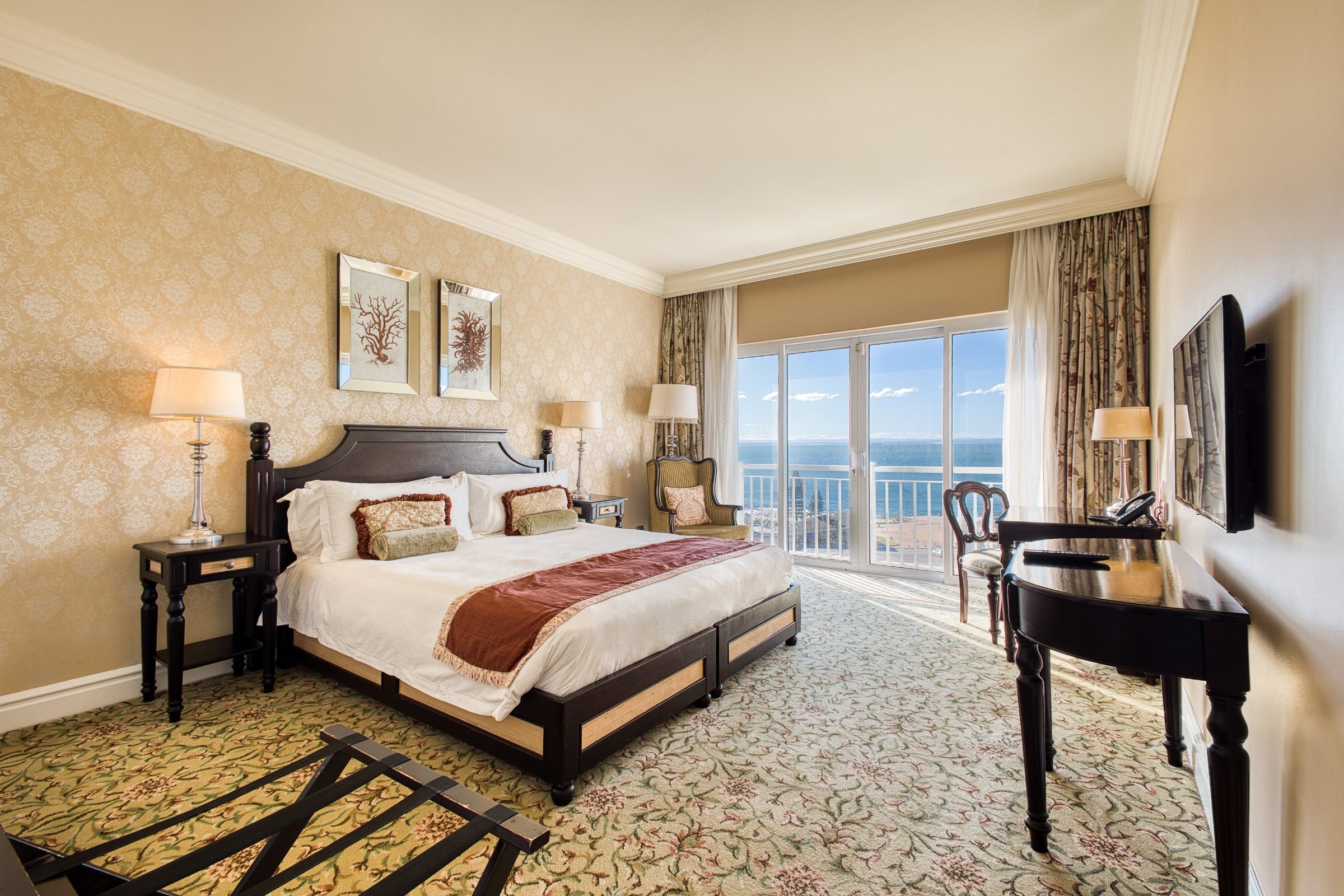 Hotel bedroom with a balcony overlooking the sea
