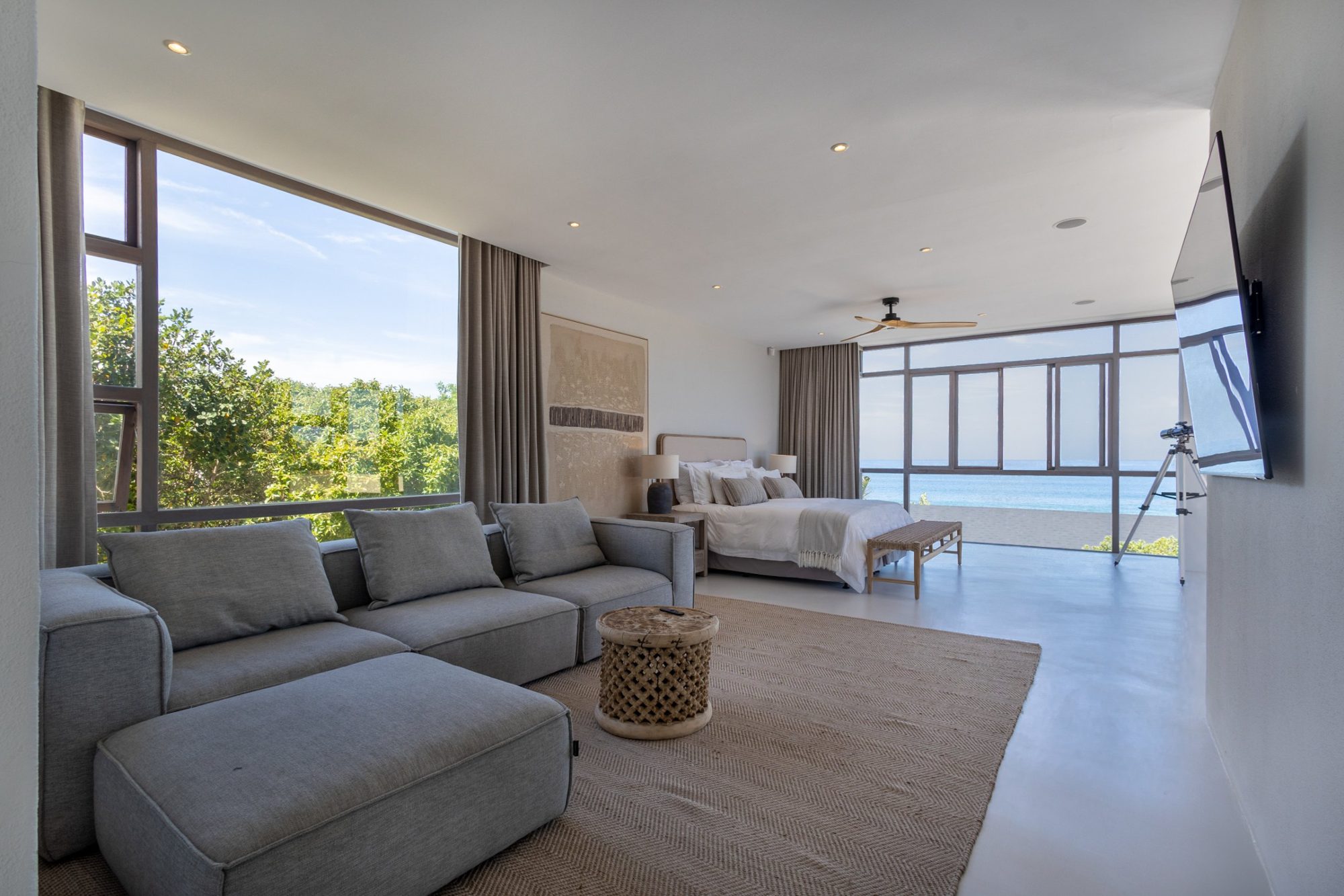 Bedroom suite with floor-to-ceiling ocean views